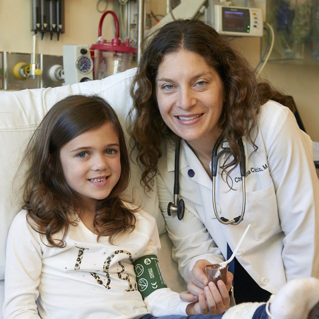 Young patient and Dr. Ciaccio smile at camera