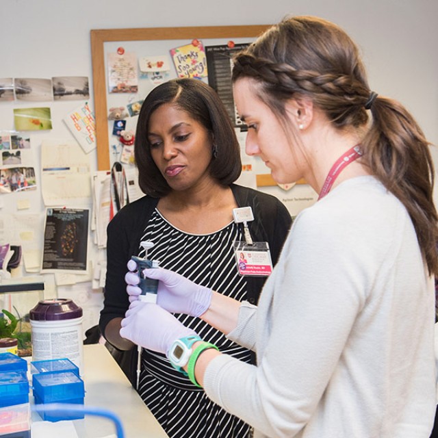 Rochelle Naylor, MD, with Lisa Letourneau, MPH, RD, LDN in a lab