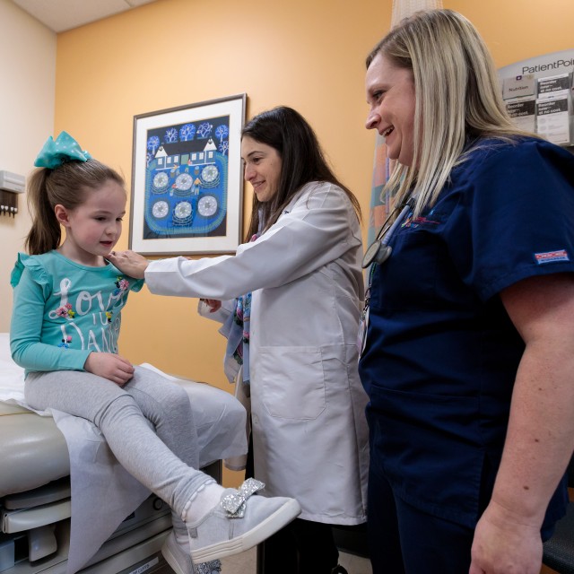 Patient Brynn Mulcahy with Melissa Tesher, MD, and Carolyn Zic, RN, BSN, CPN