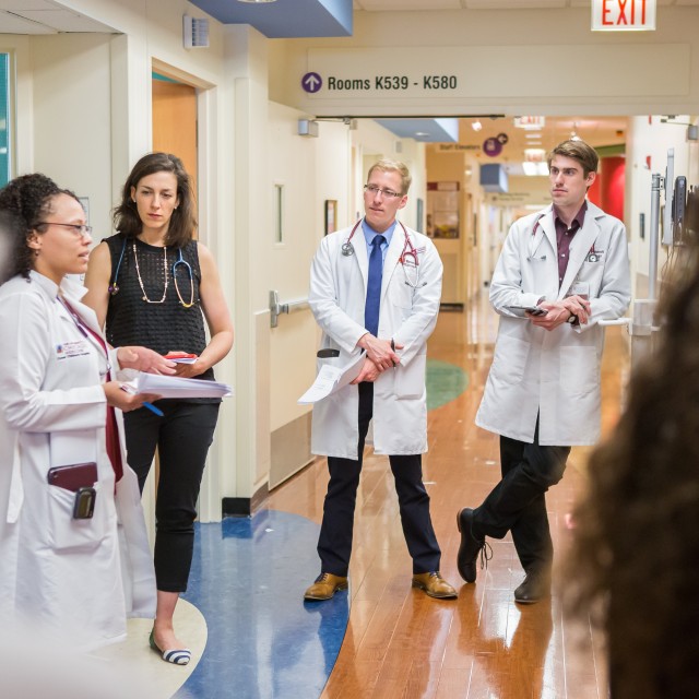 Medical students talk in hallway