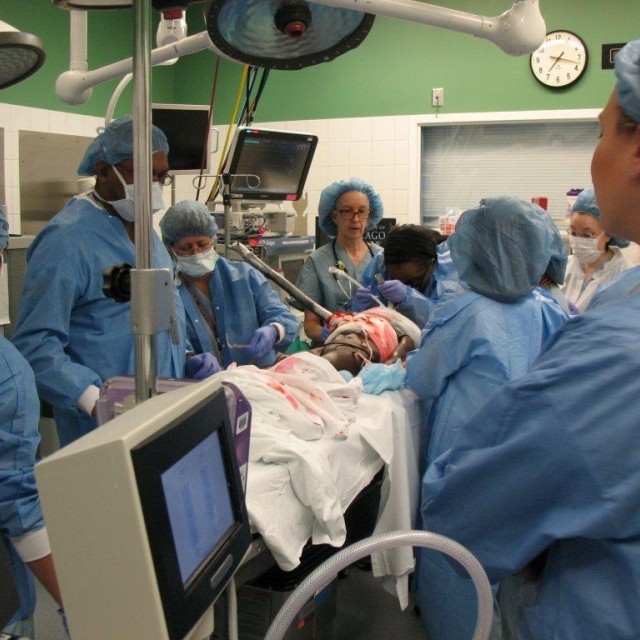 Medical providers doing an emergency surgery simulation