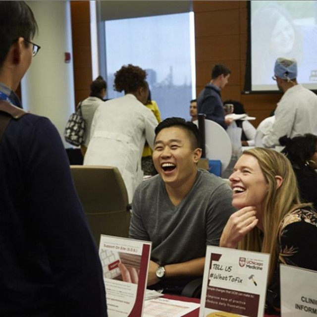 People involved in UChicago Medicine laughing together